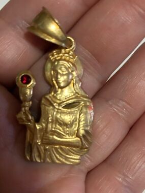 Gold-Virgin  Pendant beautiful  with Red Accent very heavy it says 18k on back